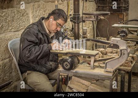 The Palestinian man, a carpenter, doing woodwork in the city of Bethlehem, West Bank, Palestine. Stock Photo
