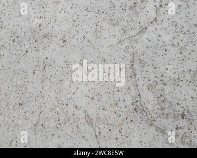 Dark concrete texture with a crumpled paper backdrop Stock Photo