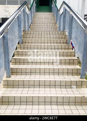The metal structure of the railing adds an industrial touch to the overall construction of the building Stock Photo