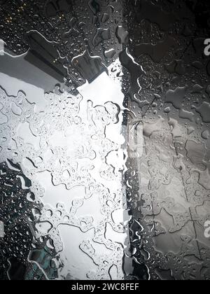 Drops of rain on the office window. Aerial view of Malaysia. blur urban ...