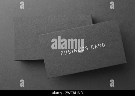 Stack of business cards on black background, top view Stock Photo