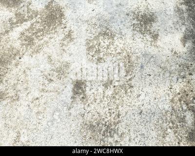 The intricate patterns on the cement wall create a mesmerizing abstract design. Stock Photo