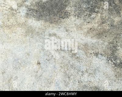 The intricate patterns on the cement wall create a mesmerizing abstract design. Stock Photo