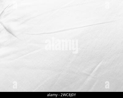 An exquisite cloth material in a bright, white hue, its smooth and silky surface evoking a sense of luxury and quality for a sophisticated background. Stock Photo