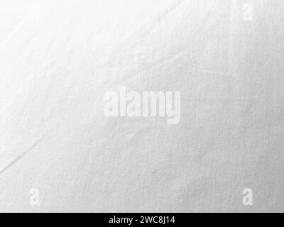 An exquisite cloth material in a bright, white hue, its smooth and silky surface evoking a sense of luxury and quality for a sophisticated background. Stock Photo