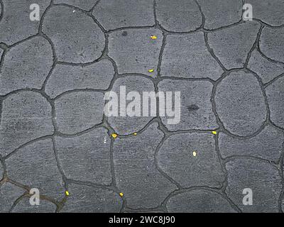 A vintage black concrete background with a textured and weathered surface, creating an abstract and timeless design for a dramatic backdrop. Stock Photo