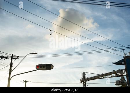 Salvador, Bahia, Brazil - January 23, 2022: Silhouette of an electricity pole against blue sky in the city of Sslvador, Bahia. Stock Photo
