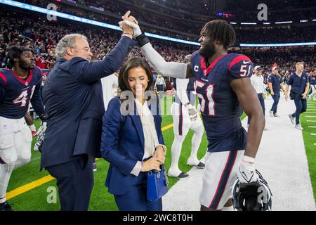 January 13, 2024: Houston Texans Chairman and CEO Cal McNair and his wife Hannah McNair celebrate a victory with defensive end Will Anderson Jr. (51) after a Wild Card playoff game between the Cleveland Browns and the Houston Texans in Houston, TX. Trask Smith/CSM Stock Photo