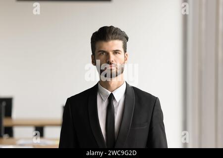 Serious handsome young executive man looking at camera Stock Photo