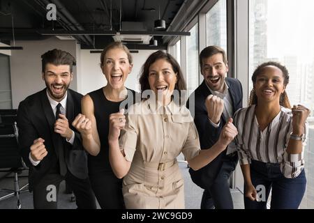 Excited group of business colleagues celebrating team success Stock Photo