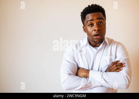 Portrait of young businessman who is shocked. Stock Photo
