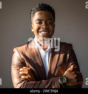 Portrait of happy businessman who is smiling and looking at camera. Stock Photo