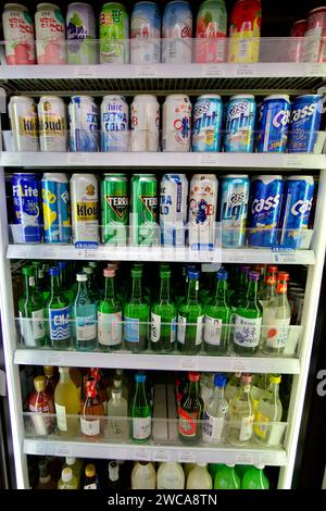 Ulsan, South Korea - March 3, 2020: A well-stocked beer section in a convenience store cooler with the door open, displaying an assortment of beers on Stock Photo