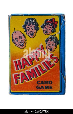 old retro well used box of Happy Families playing cards isolated on white background - UK Stock Photo