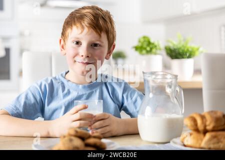 Portrait of a little boy who drank milk and has a mustache from him. Stock Photo