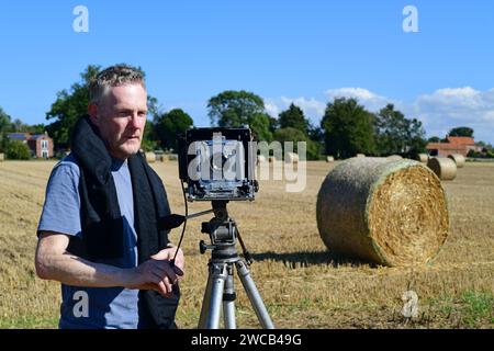 man using large format mpp (micro precision projects) 5x4 inch plate film camera, at harvest time york yorkshire united kingdom Stock Photo