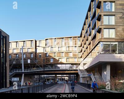 View towards hotel with bridge structure from cycle path. The Westin London City, London, United Kingdom. Architect: Studio Moren, 2022. Stock Photo