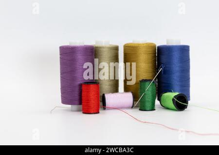 A vibrant assortment of colorful spools and threads, showcasing a diverse range of hues Stock Photo