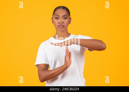 Serious Young Black Woman Showing Time Out Hand Gesture, Studio Stock Photo