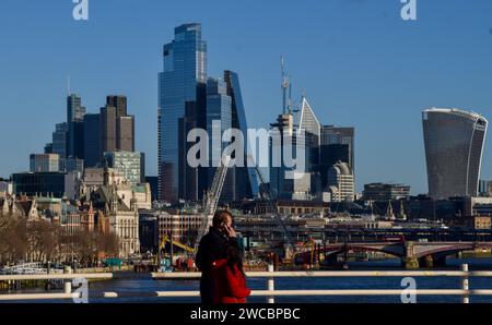London, England, Uk. 15th Jan, 2024. People walk along Waterloo Bridge past the City of London skyline, the capital's financial district, on a clear day. (Credit Image: © Vuk Valcic/ZUMA Press Wire) EDITORIAL USAGE ONLY! Not for Commercial USAGE! Credit: ZUMA Press, Inc./Alamy Live News Stock Photo