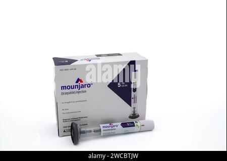 POTTERVILLE, MI - JANUARY 14, 2024: Mounjaro tirzepatide prescription box with injection pen isolated on a white Stock Photo