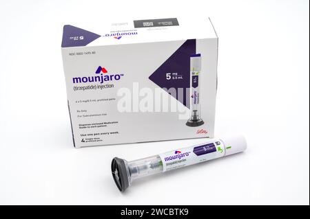 POTTERVILLE, MI - JANUARY 14, 2024: Mounjaro tirzepatide prescription box with injection pen isolated on a white Stock Photo