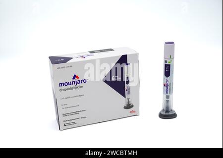 POTTERVILLE, MI - JANUARY 14, 2024: Mounjaro tirzepatide prescription box with injection pen isolated on a white Stock Photo