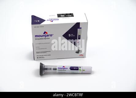 POTTERVILLE, MI - JANUARY 14, 2024: Mounjaro tirzepatide prescription box with injection pen isolated on a white Stock Photo