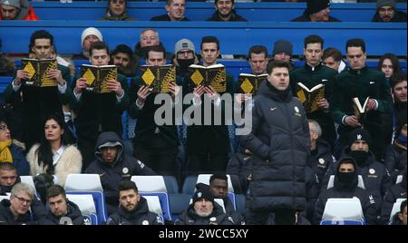 Argylle film actors stunt to promote the movie at Stamford Bridge reading the Argylle book behind Mauricio Pochettino Manager of Chelsea dugout. - Chelsea v Fulham, Premier League, Stamford Bridge Stadium, London, UK - 13th January 2024. Editorial Use Only - DataCo restrictions apply. Stock Photo