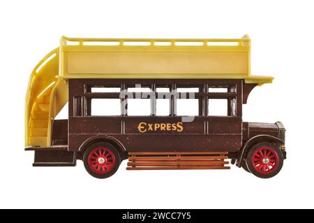 Ancient brown double-decker bus toy isolated on a white background Stock Photo