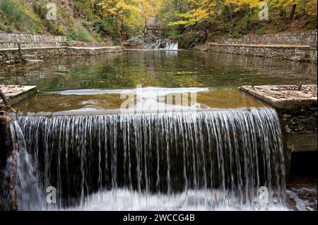 Landscape with artificial small lake and autumn colourful foliage on Mount Paiko in northern Greece Stock Photo