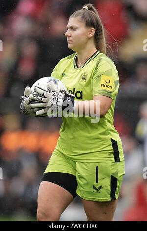 Newcastle United goalkeeper Grace Donnelly punches clear a shot from ...