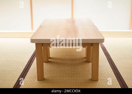 Wooden table on the Zashiki or a type of cross-legged seating in Japan for rooms that use tatami floors Stock Photo