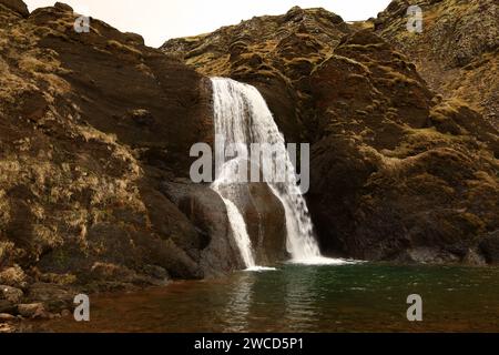 Helgufoss is a waterfall near the capital of Iceland, located in Mosfellsdalur valley Stock Photo