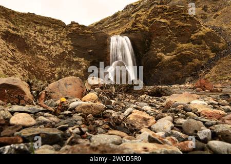 Helgufoss is a waterfall near the capital of Iceland, located in Mosfellsdalur valley Stock Photo