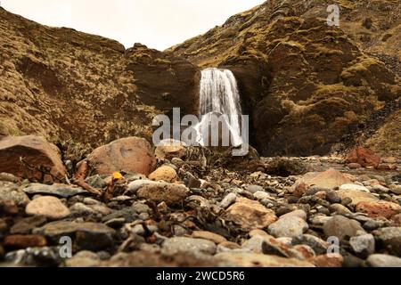 Helgufoss is a waterfall near the capital of Iceland, located in Mosfellsdalur valley Stock Photo