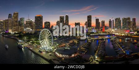 American urban landscape at night. Miami marina and Skyviews Observation Wheel at Bayside Marketplace with reflections in Biscayne Bay water and skysc Stock Photo