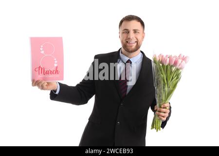 Handsome businessman with tulips and greeting card on white background. International Women's Day celebration Stock Photo