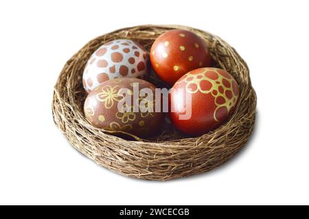 Easter eggs in nest isolated on white background Stock Photo