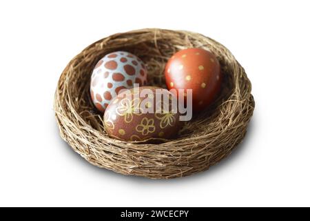 Easter eggs in nest isolated on white background Stock Photo