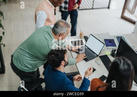 Multiracial Business Group Collaborating on Strategic Planning and Market Analysis Stock Photo