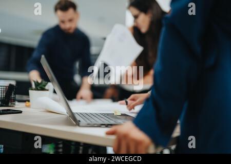 Multiracial Colleagues Analyzing Reports for Successful Business Growth Stock Photo