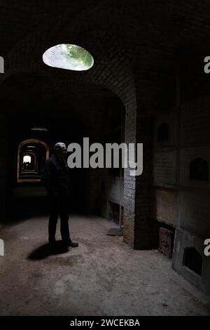 Ian Dungavell, CEO, Friends of Highgate Cemetery Trust inside the Terrace Catacombs at Highgate Cemetery, North London graveyard, London, England, UK Stock Photo