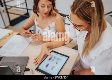 Efficient Multiracial Business Team Analyzing Reports and Solving Problems Stock Photo