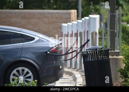 Tesla vehicles being charged at a Tesla charging station in Southlake ...