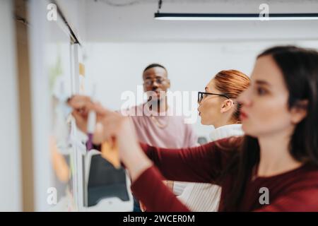 Business professionals collaborate and brainstorm to expand their business, strategize, and target specific customer groups in a corporate office. Stock Photo