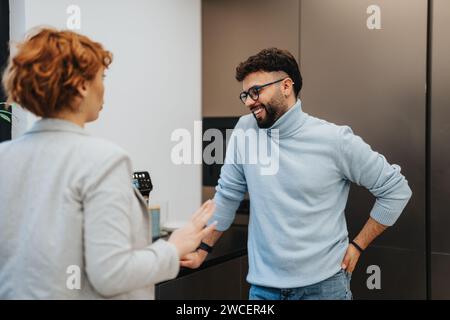 Business professionals collaborating over tea in a pleasant office atmosphere Stock Photo