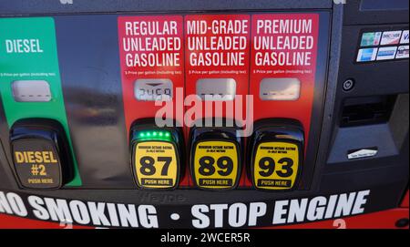 Close up photo of a gas pump showing different grades of gasoline - November 2023 Stock Photo