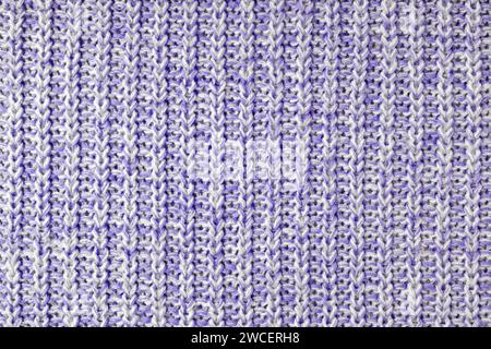 Jersey textile background , purple white melange knitted wool fabric. Woolen knitwear, sweater, pullover surface texture, textile structure, cloth sur Stock Photo