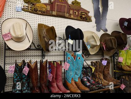 Vintage cowboy hats and boots in an antique store - November 2023 Stock Photo